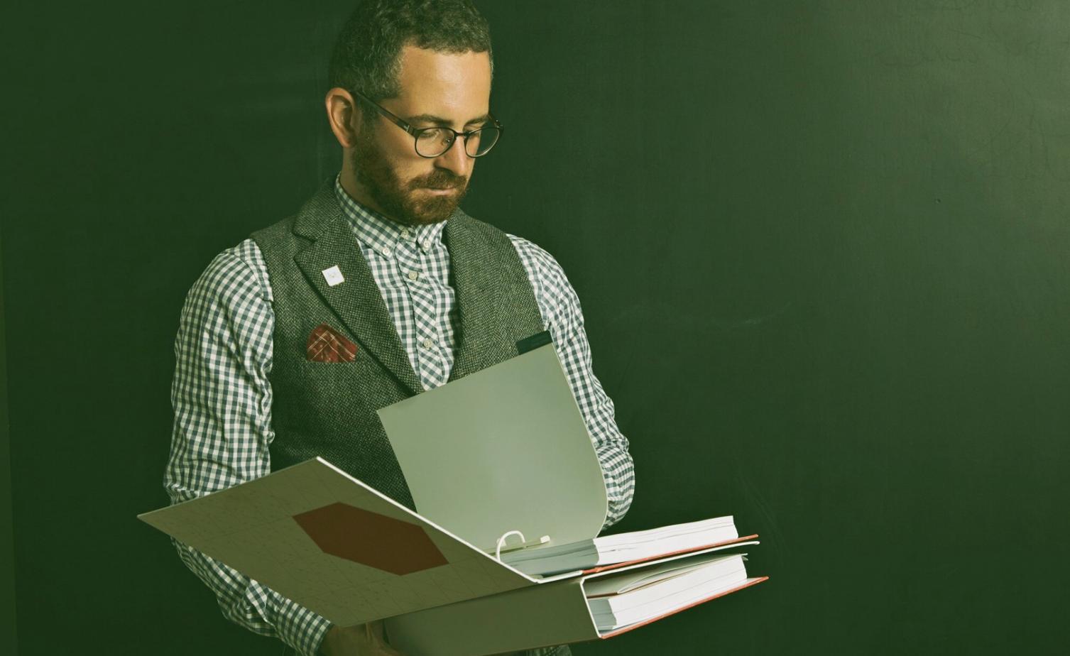 Student reviewing financial documents and budgeting materials