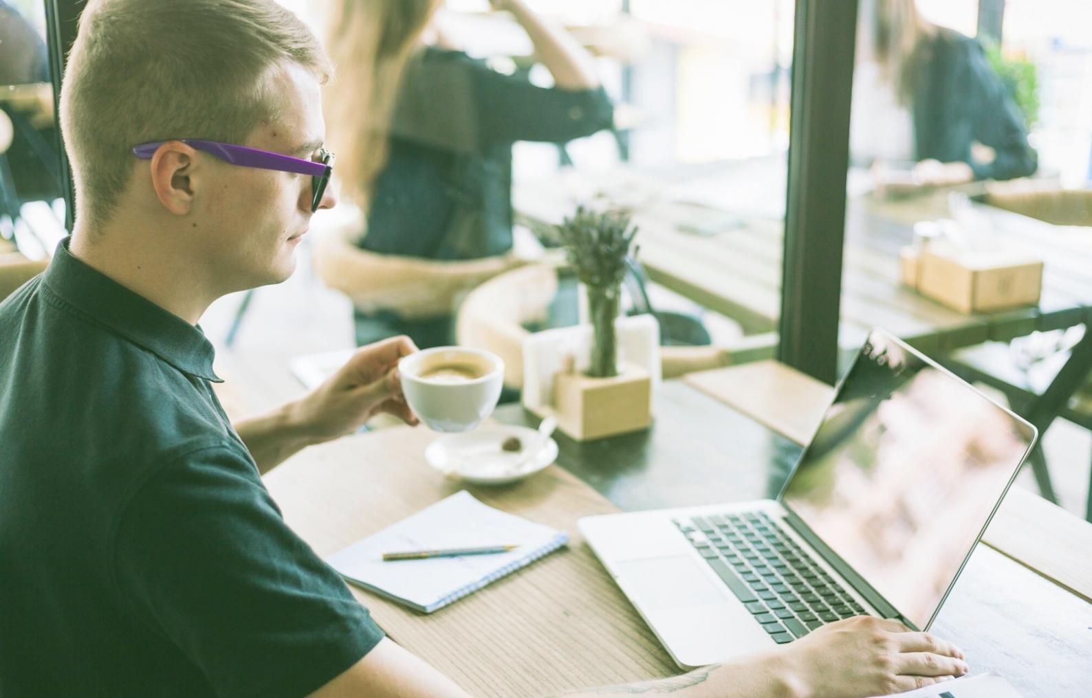 Student reviewing budget spreadsheet with expense categories and monthly allocations